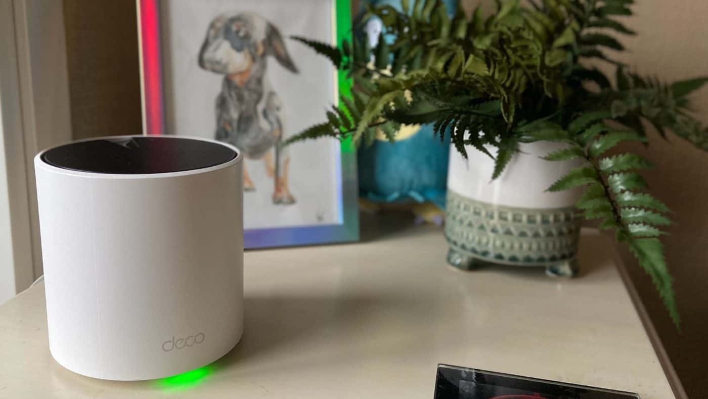 Wi-Fi mesh pod on a living room shelf